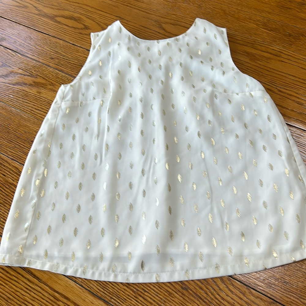 See You Soon sleeveless holiday top. Size XS.  Cream with gold feathers.